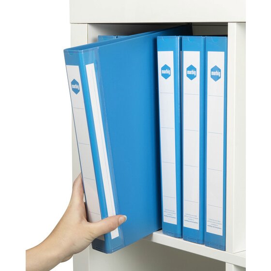 Hand taking a blue Marbig Deluxe binder from a white shelf of blue binders with white paper spine labels