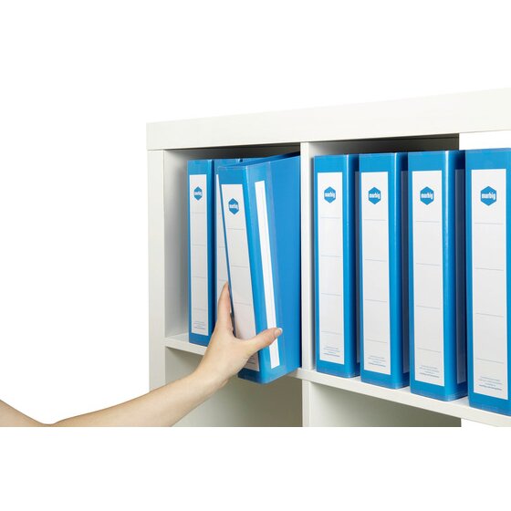 Row of blue Marbig Deluxe binders on a white shelf, each with a white spine label, while a hand slides one out