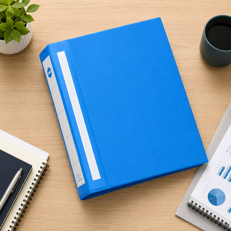 Top down workspace view of the Marbig Deluxe A4 Blue Ring Binder surrounded by notebooks, coffee and office stationery, showcasing its clean professional appearance and organised desktop appeal.