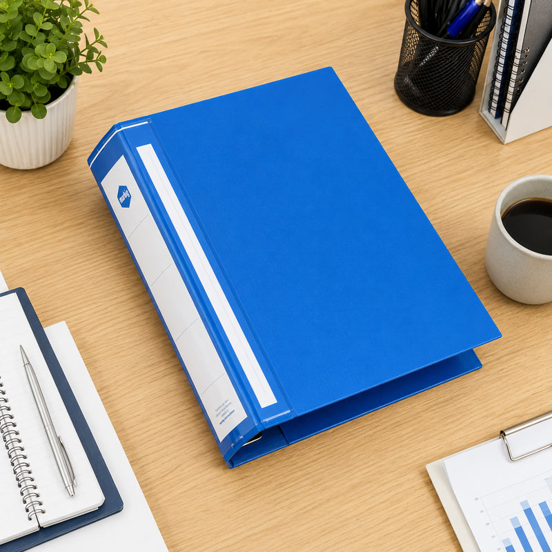 Top view of the Marbig Deluxe Blue Ring Binder positioned on a tidy office desk with notebooks, stationery and coffee, showcasing its professional appearance and practical workspace organisation.