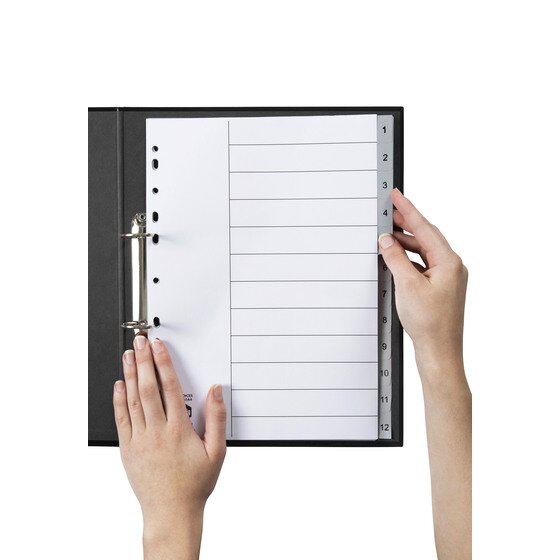 Hands turning a numbered grey tab on a Marbig 1 to 12 polypropylene index filed in a black 2 ring binder