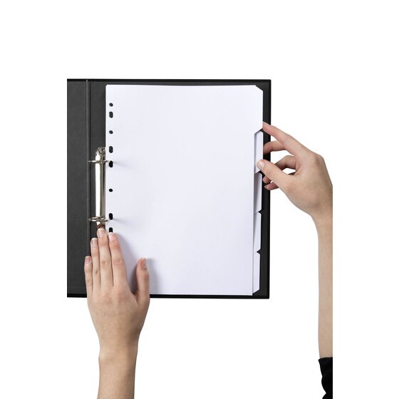 Hands lifting a blank white tab of the Marbig 5 tab white manilla dividers filed in a black 2 ring binder
