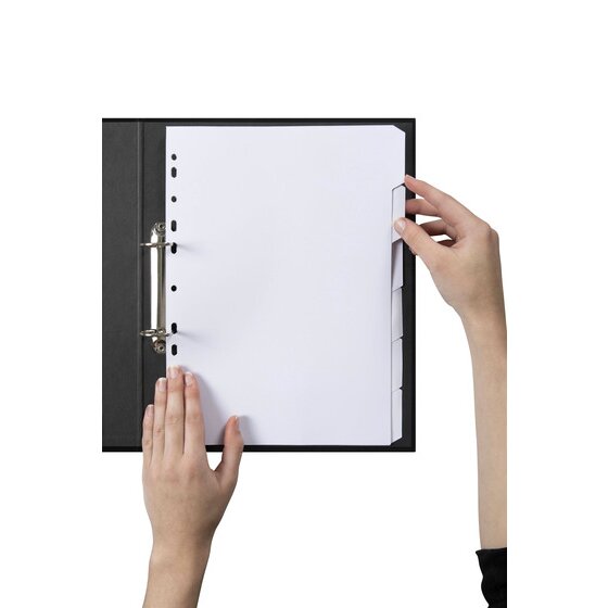 Hands lifting a white tab of the Marbig 6 tab white manilla dividers filed in a black 2 ring binder
