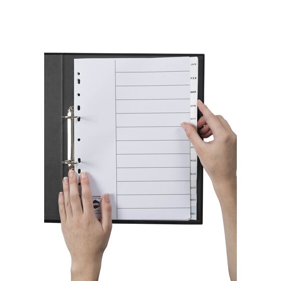 Hands turning a monthly tab in the Marbig Jan to Dec white polypropylene divider set inside a black A4 ring binder