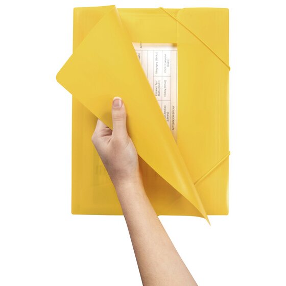 Hand lifting the yellow cover of a Marbig document file to show a printed table on the page inside