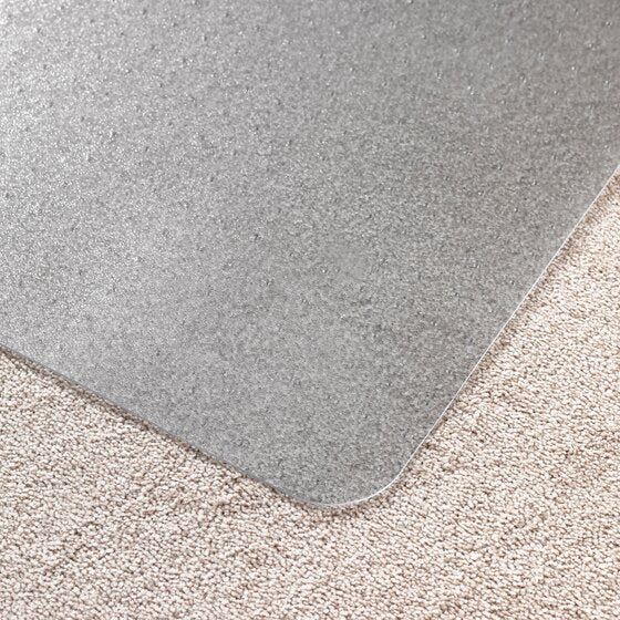 Edge of a clear Marbig Duramat chairmat on beige carpet, the carpet texture showing through the PVC