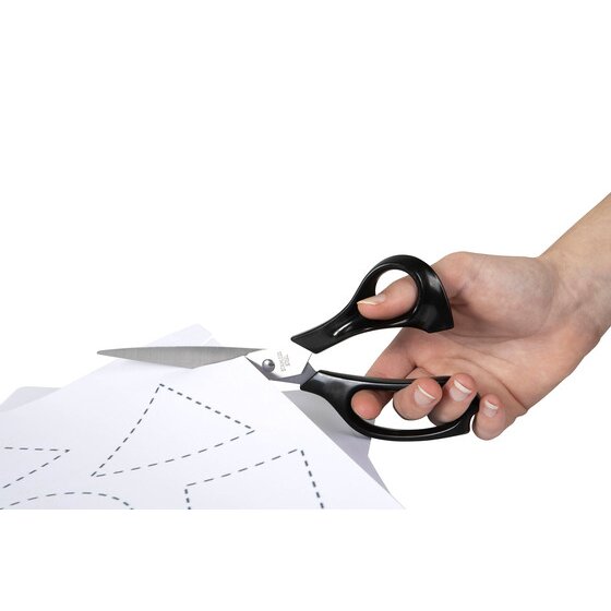 Hand cutting a sheet of white paper along a dotted line with black handled Marbig Enviro scissors
