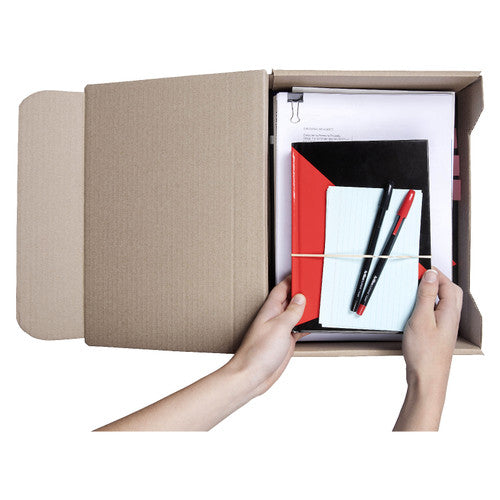 Hands placing notebooks, pens and papers into an open Marbig A4 transfer box