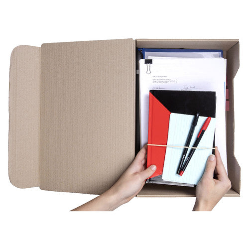 Hands resting a notebook and pens on foolscap papers packed inside an open Marbig foolscap transfer box