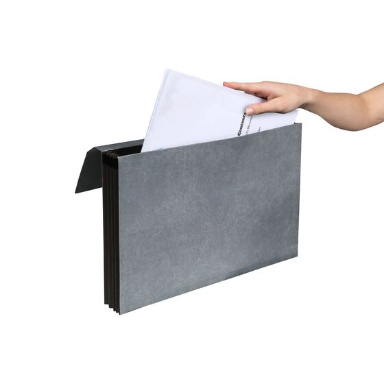 Hand placing a stack of papers into an open Marbig heavy duty expanding wallet, black pleated sides visible