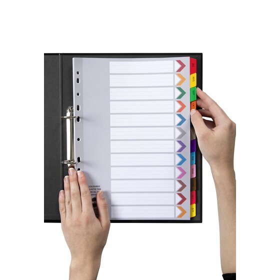 Hand turning a month tab in a Marbig financial year reinforced divider set filed in a black 2 ring binder