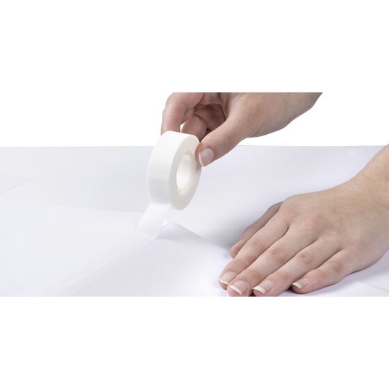 Hand pulling Marbig invisible tape across a white sheet of paper, the strip hard to see against the page