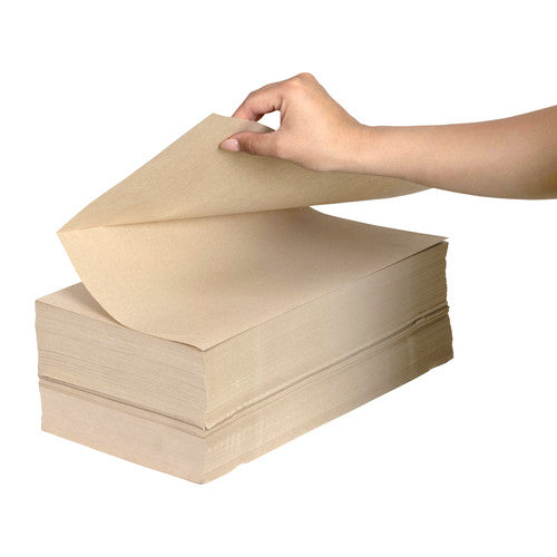 Hand lifting the top sheet of a fan folded stack of Marbig Professional brown kraft void fill paper