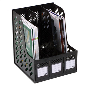 Marbig 864100 black three section magazine rack with slotted side panels and a white label card on the low front of each section, holding magazines