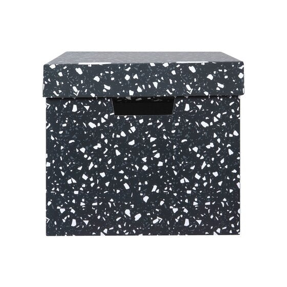 End view of a Marbig terrazzo archive box, lid on, white and grey chips over charcoal with a hand hole in the end