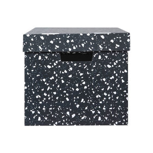 End view of a Marbig terrazzo archive box, lid on, white and grey chips over charcoal with a hand hole in the end