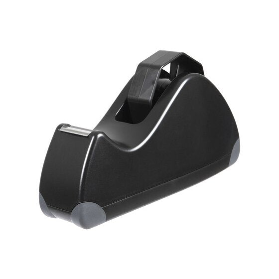 Empty Marbig Pro Series large tape dispenser seen at an angle, showing the raised roll cradle, front cutter and grey rubberised corner feet