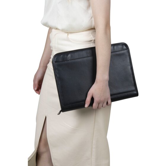 A person carrying the closed black Marbig R90087 zip pad holder at their side, showing its size against the body
