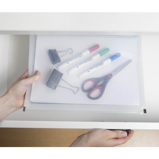 Hand sliding a clear Marbig Professional zip wallet holding a ruled pad, markers, binder clips and scissors into a desk drawer