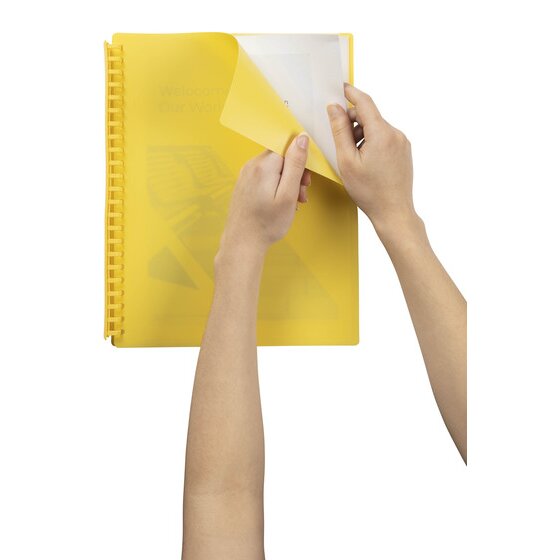 Two hands lifting the yellow front cover of a Marbig refillable display book to show a document in the first clear pocket