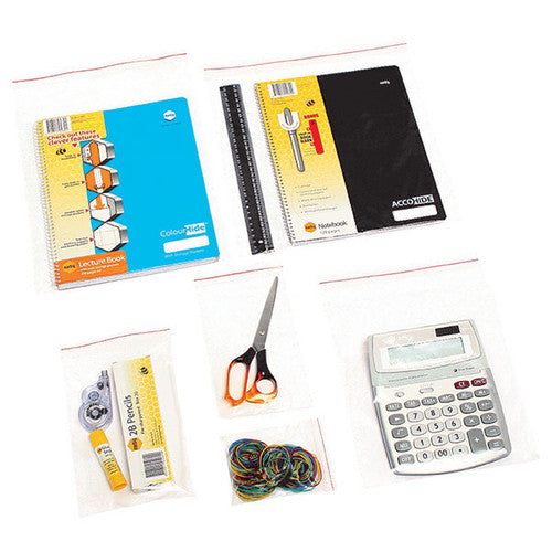 Clear resealable polybags in several sizes holding notebooks, a ruler, scissors, a calculator, rubber bands, pencils and a glue stick