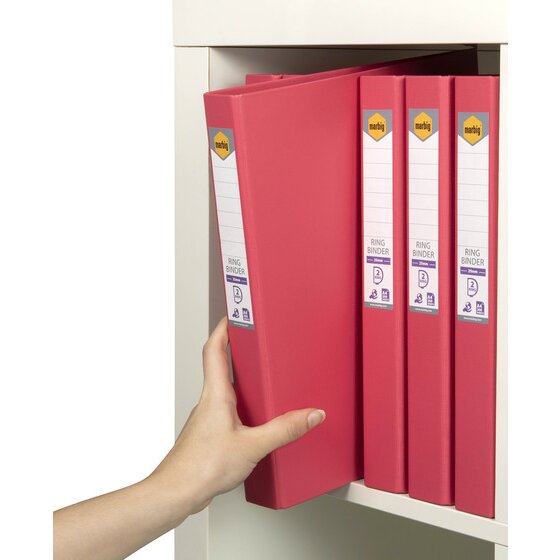 Hand lifting a coral Marbig binder from a shelf of coral binders, spine labels reading ring binder, 25mm and 2 ring