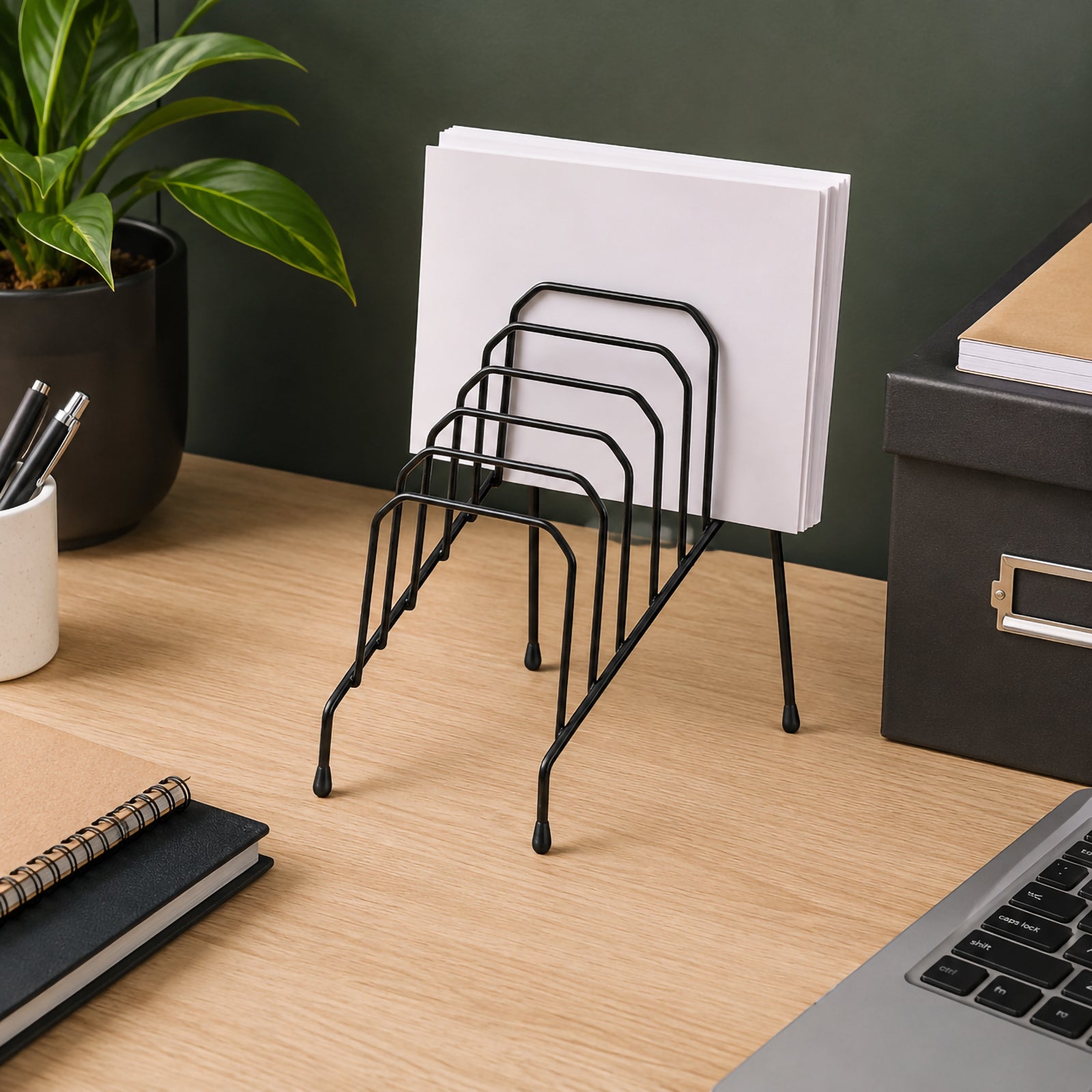 The Marbig Step File Wire Organiser Small Black displayed on a tidy office desk with neatly arranged documents, showing its durable wire construction and professional appearance in a productive workspace.