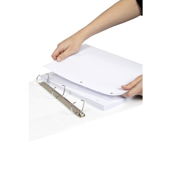 Two hands lowering a stack of punched white paper onto the three open D rings of a white Marbig binder