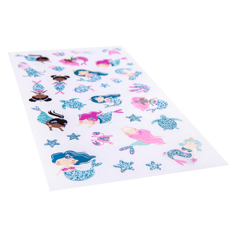 Angled product view highlighting the glitter texture and sparkling finish across the ocean themed sticker designs. Mermaids, starfish and sea creatures are showcased with vibrant colours and reflective glitter accents.