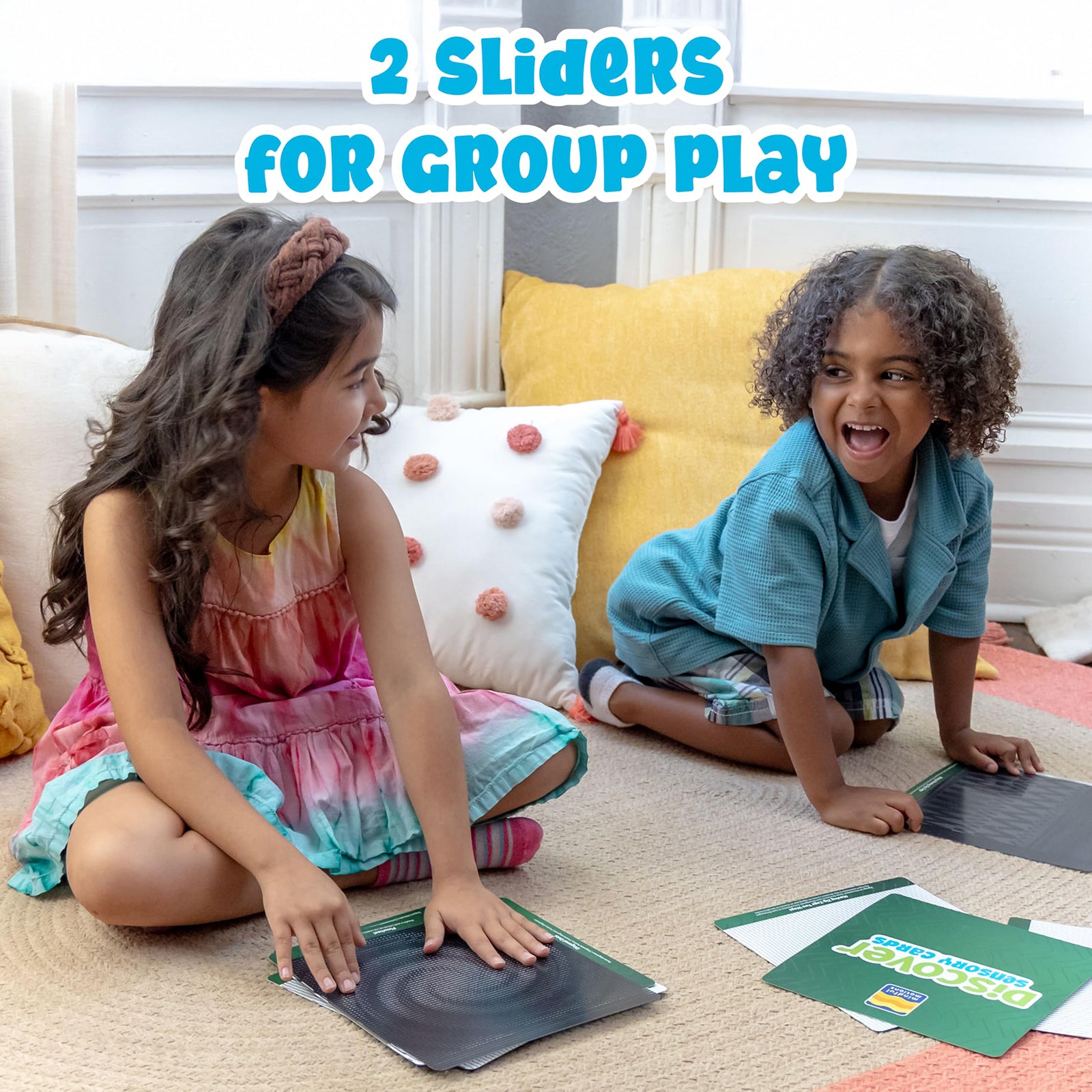 Two children engaging in cooperative sensory play with the optical illusion cards while exploring movement and visual patterns together.