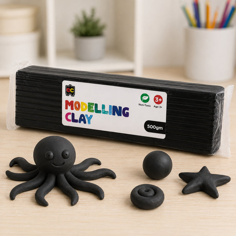 Educational Colours 500g black modelling clay pack displayed on a tabletop beside a handmade black octopus figure and small clay shapes in a creative arts and crafts environment.