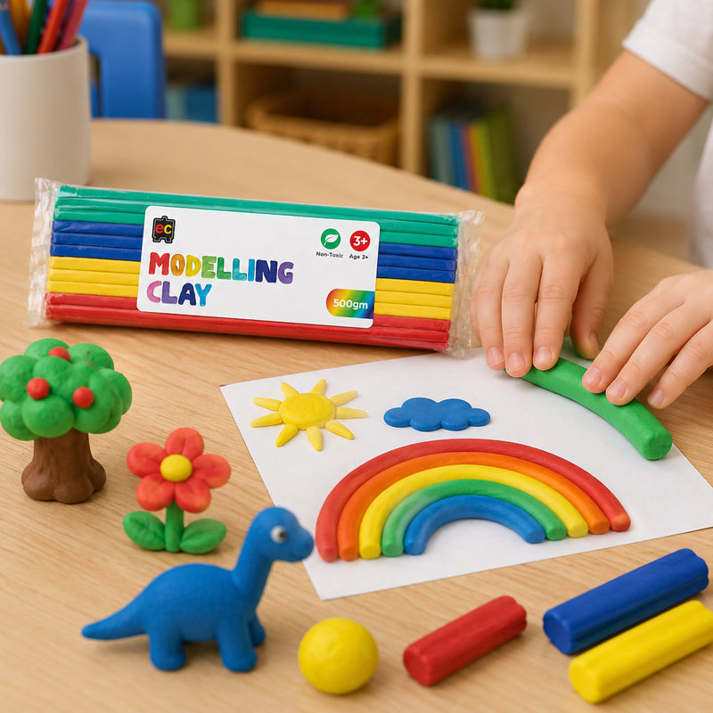 Educational Colours Modelling Clay 500g Multicolour displayed beside handmade rainbow, dinosaur, tree, and flower clay creations during a classroom craft activity.