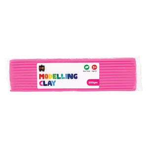 A packaged 500g block of Educational Colours Pink Modelling Clay wrapped in clear plastic with a colourful branded label. The packaging highlights the non toxic formula and suitability for children aged 3 years and above, presenting the reusable clay designed for sculpting, modelling, arts and educational craft projects.