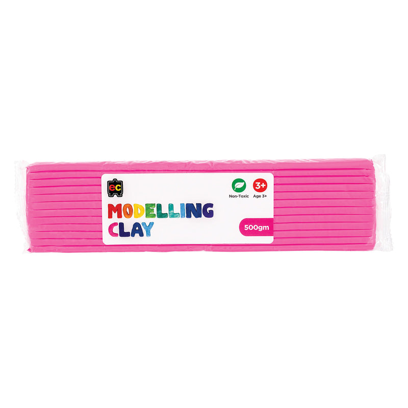 A packaged 500g block of Educational Colours Pink Modelling Clay wrapped in clear plastic with a colourful branded label. The packaging highlights the non toxic formula and suitability for children aged 3 years and above, presenting the reusable clay designed for sculpting, modelling, arts and educational craft projects.