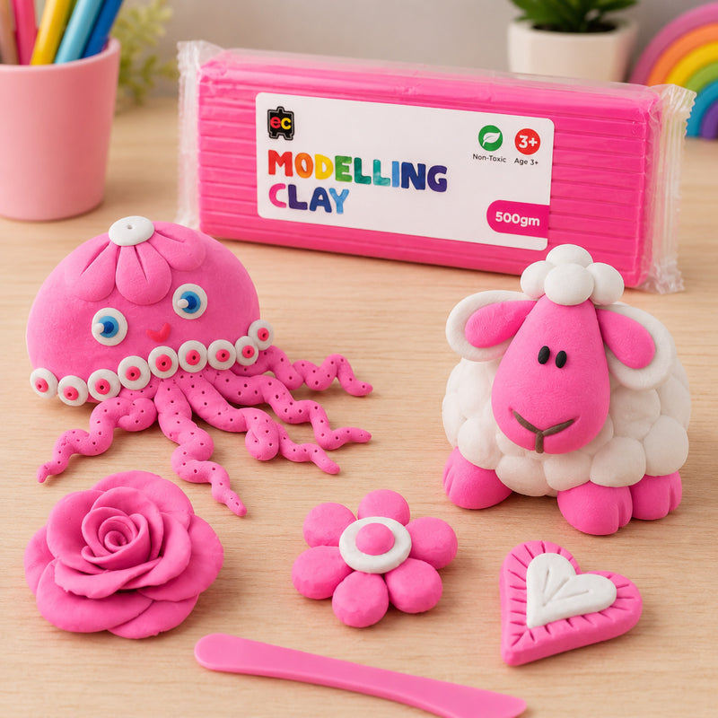 Educational Colours Modelling Clay 500g Pink displayed with handmade pink clay octopus, sheep, flower, rose, and heart shapes on a bright wooden craft table.