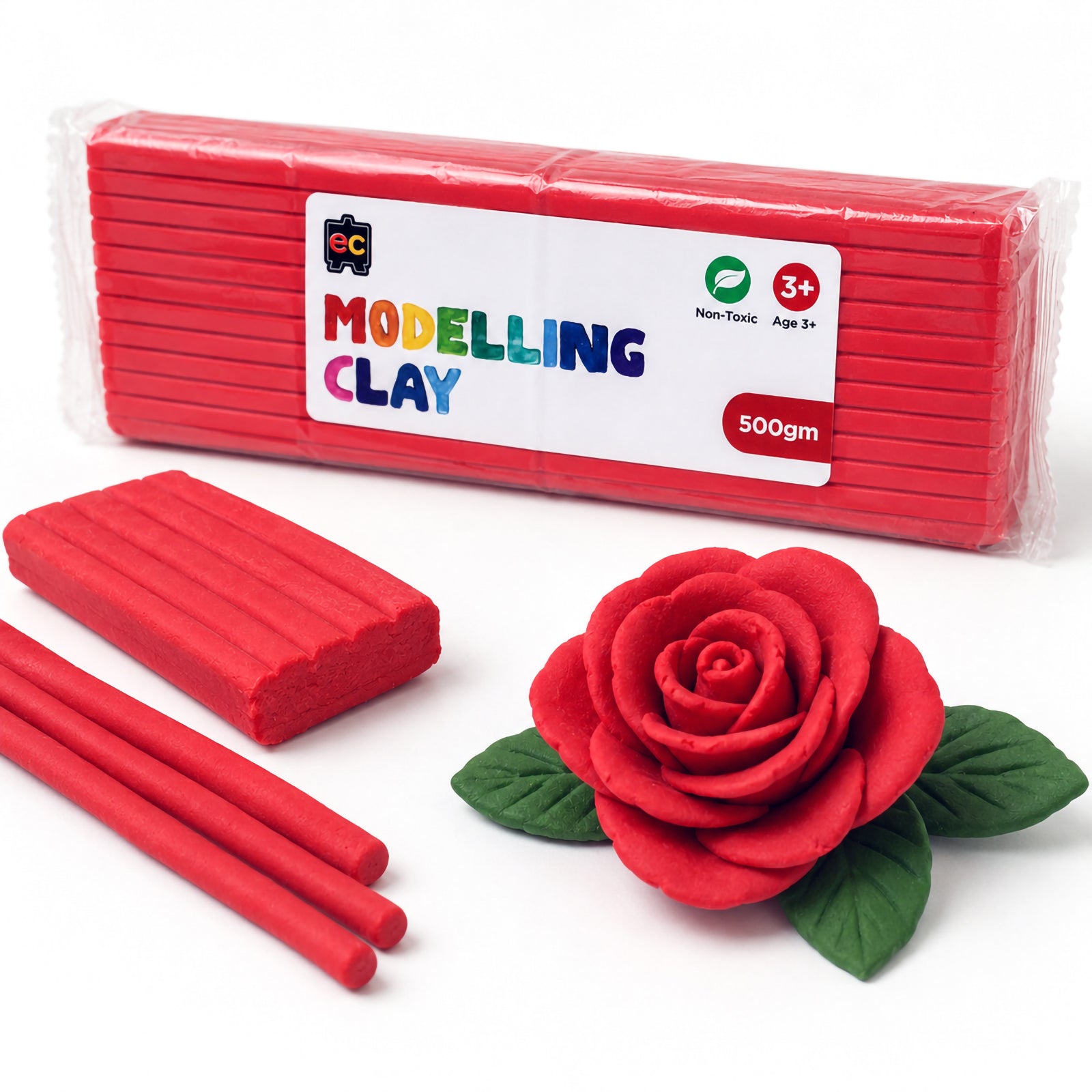 Educational Colours 500g red modelling clay pack displayed beside handcrafted red clay roses and rolled clay pieces on a clean white background.