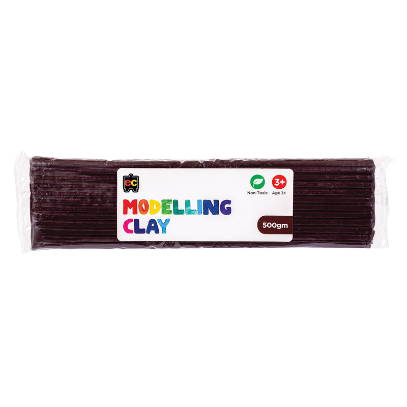 A packaged 500g block of Educational Colours Brown Modelling Clay wrapped in clear plastic with a colourful branded label. The packaging highlights the non toxic formula and suitability for children aged 3 years and above, presenting the reusable clay block designed for sculpting, arts, crafts and educational modelling activities.