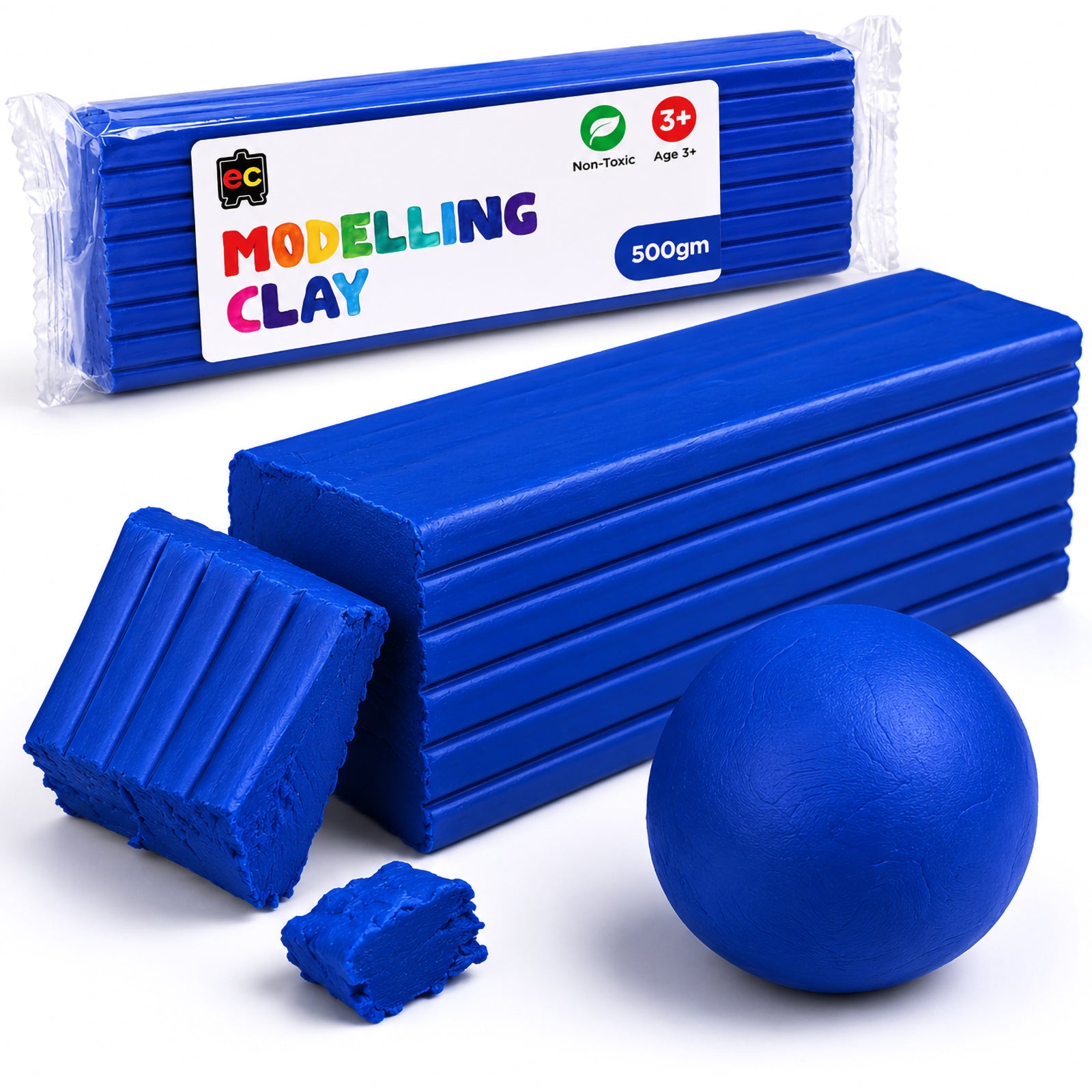 Close-up studio photograph of Educational Colours Modelling Clay 500gm Dark Blue showing the clay block texture, packaging, and molded clay shapes on a white background.
