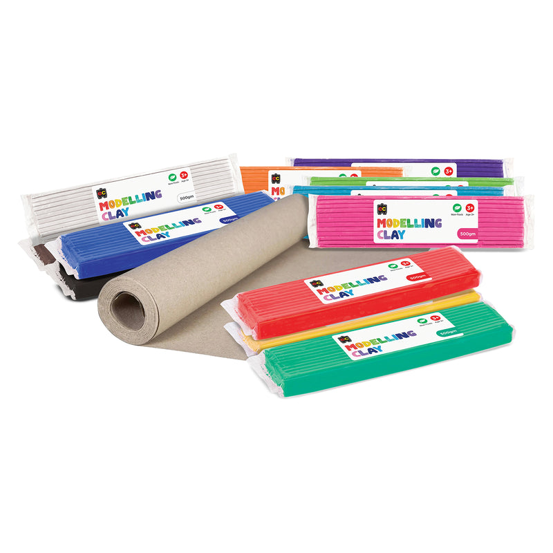 Educational Colours Modelling Clay School Kit displayed with multiple 500g clay blocks in assorted bright colours surrounding a roll of kraft paper, highlighting the complete classroom set designed for group art projects and creative learning sessions.