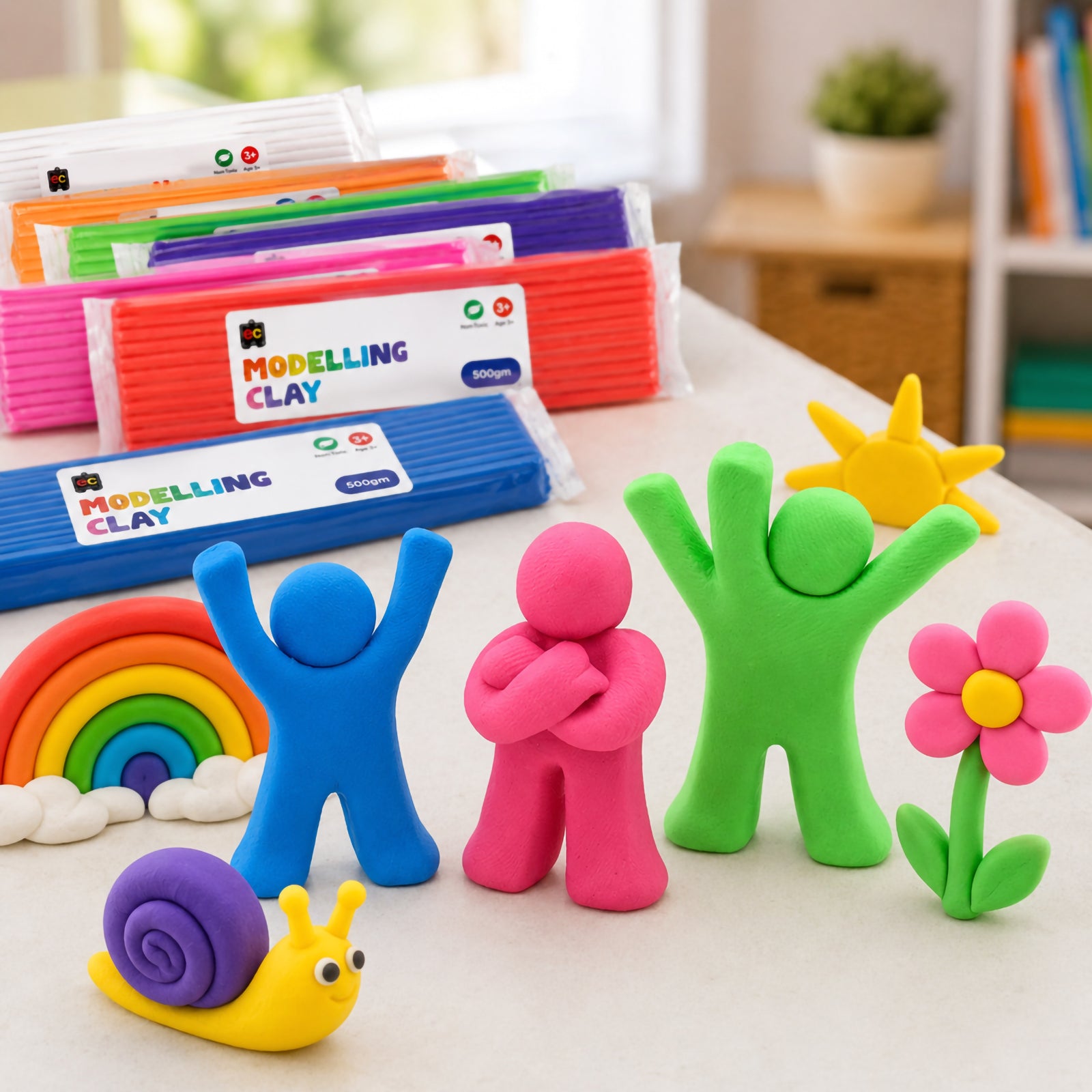 Bright modelling clay people, rainbow, flower and snail creations arranged on a clean tabletop with colourful modelling clay packs in a creative playroom setting.