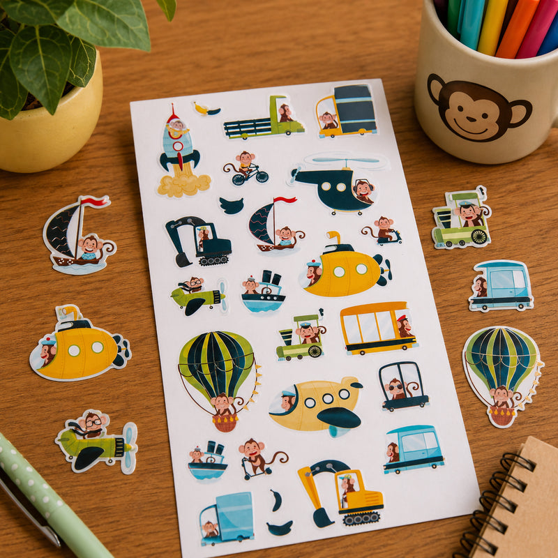 Complete Monkey Adventures sticker sheet displayed with individual stickers arranged around it. The collection showcases monkeys riding bicycles, sailing boats, flying aircraft and exploring exciting destinations through colourful transport themed illustrations.