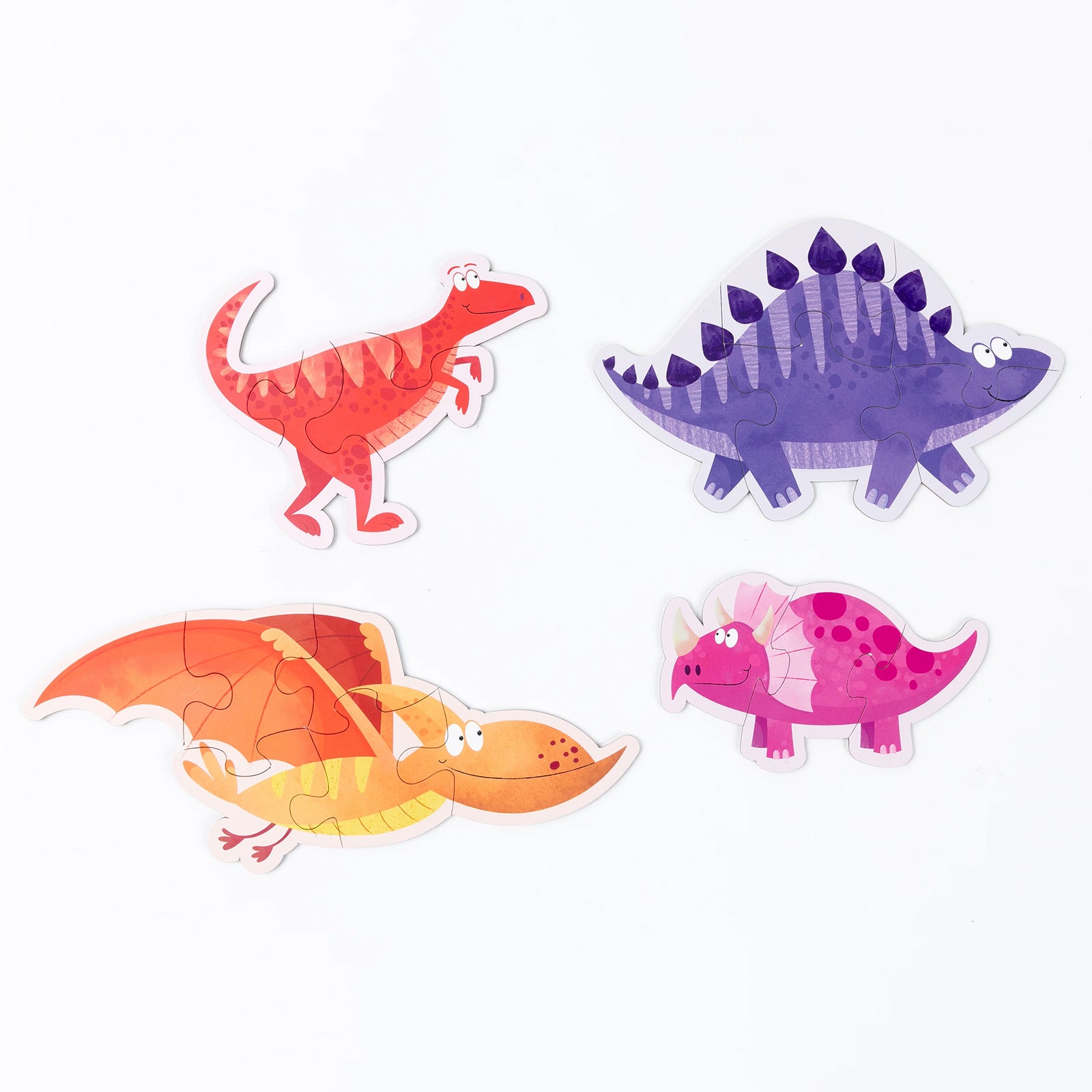 Four completed dinosaur shaped puzzles displayed on a plain background featuring a red dinosaur, purple stegosaurus, orange flying reptile and pink triceratops style character with progressive piece counts.