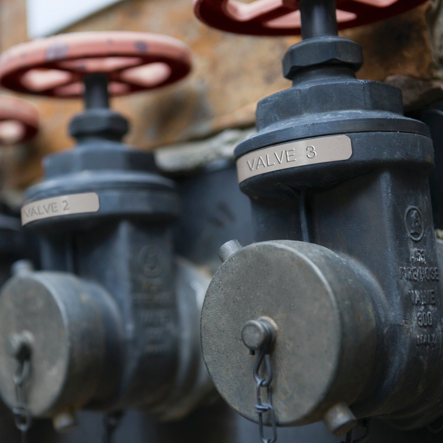 Close-up of industrial valves with 'Valve 3' and 'Valve 2' labels.