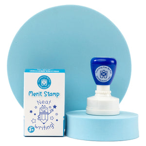 Retail packaging and Neat Writing Merit Stamp displayed together on a presentation stand. The packaging showcases the educational reward design, making it a practical classroom tool for celebrating neat and accurate written work.