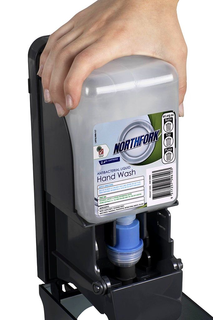 Northfork GECA Antibacterial Liquid Hand Wash cartridge being loaded into a wall dispenser
