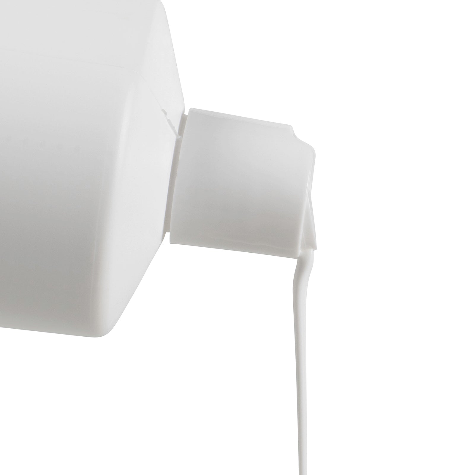 Close up side view of the Northfork Cream Cleanser bottle dispensing the white cream cleanser from the flip top cap. The image clearly demonstrates the smooth consistency and controlled application of the ready to use formula.