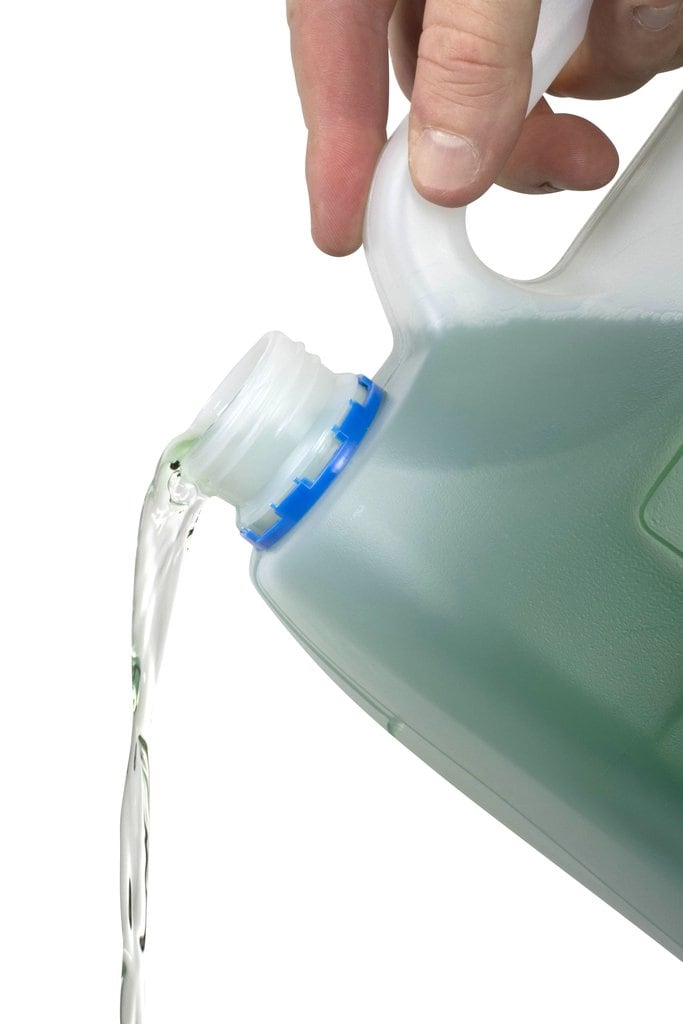 Northfork Lime and Scale Remover being poured from the 5 litre container, from a carton of 3