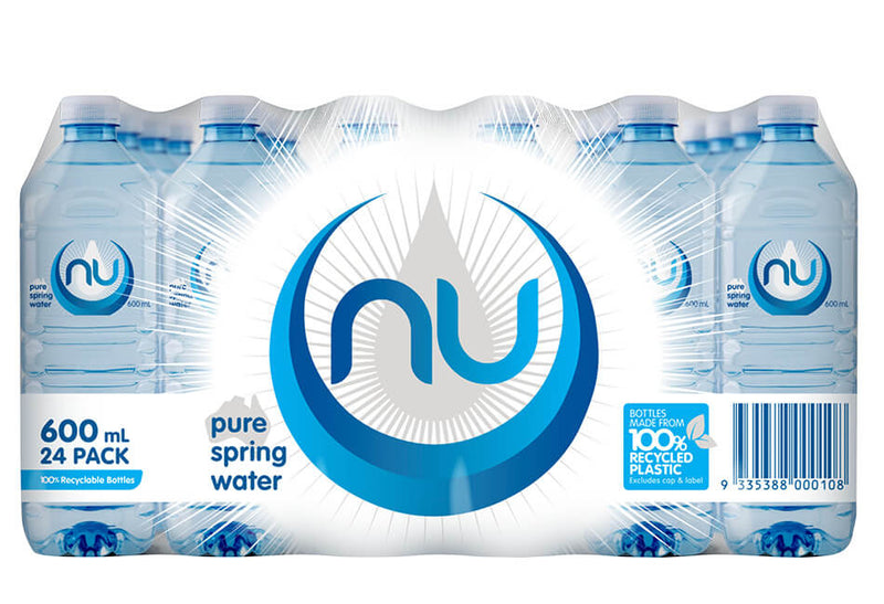 Case of 24 Nu Pure 600ml square PET spring water bottles with blue and white NU labels, shrink wrapped as a retail ready 24 pack tray on a white background