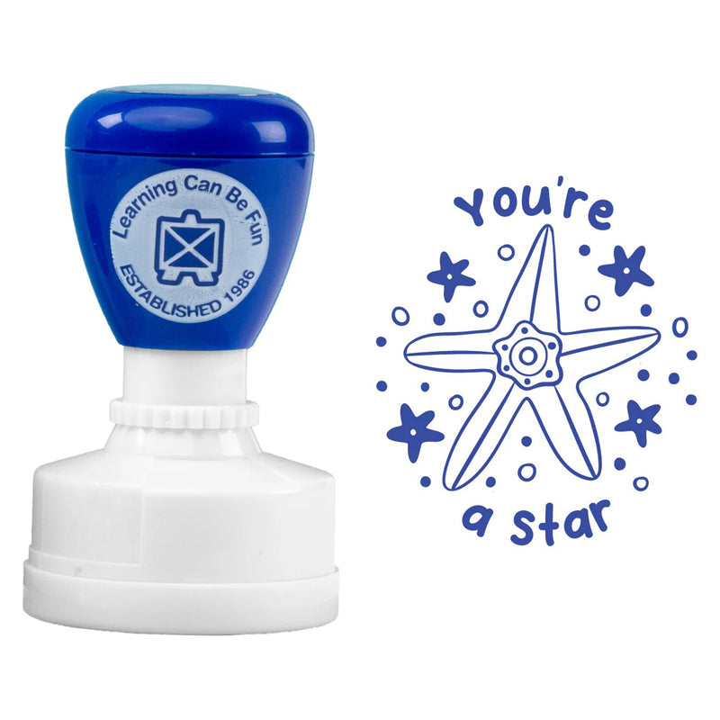 Product close up showing the blue self inking merit stamp alongside the complete You're a Star starfish design. The image clearly displays the intricate illustration details and encouraging message created for student achievement recognition.