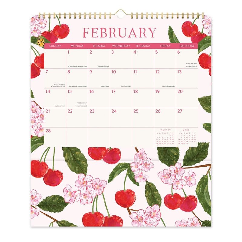 Orange Circle 2027 Pockets Plus Wall Calendar 297 x 348mm Fruit And Flora opened to show the printed monthly grid and the dated planning layout inside.